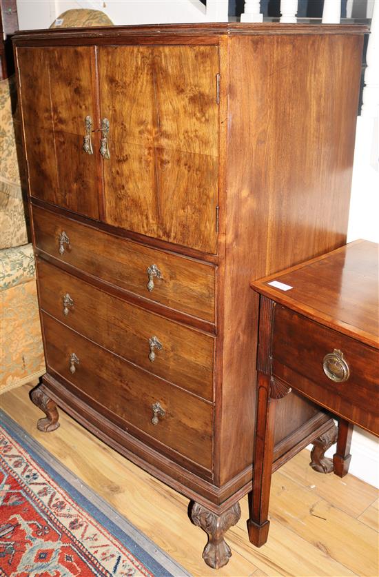 A 1930s walnut press cupboard, W.77cms